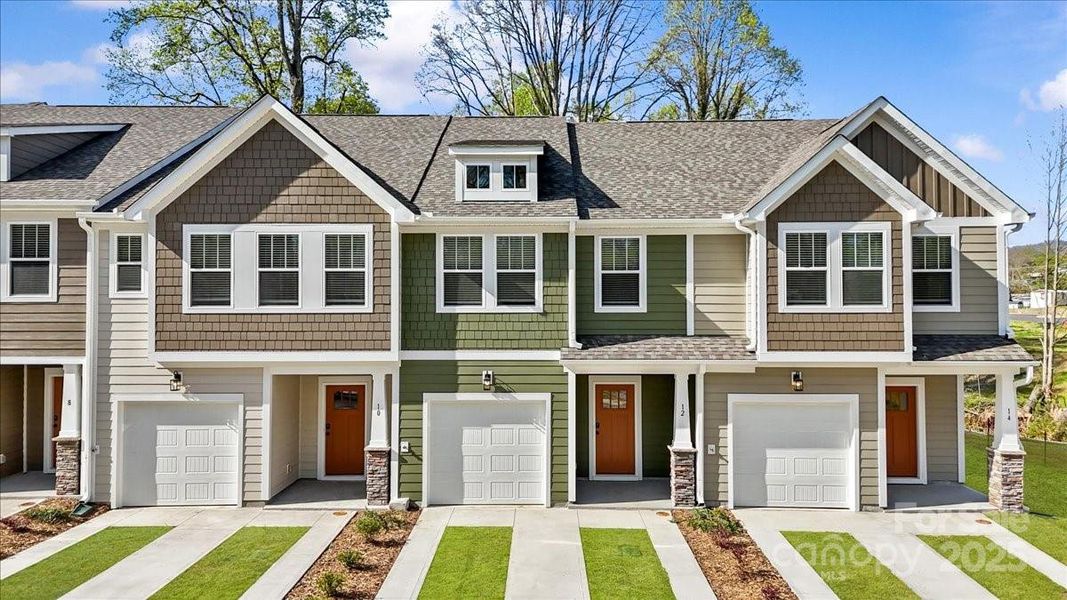 Front exterior of a new home in Clayton Crossing, Arden, NC, highlighting curb appeal (Image 17). Front exterior of a new home in Clayton Crossing, Arden, NC, highlighting curb appeal (Image 17).