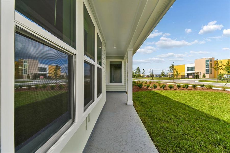 Exterior details and patio area of a home in Weslyn Park in Sunbridge 34', St. Cloud (Image 3).