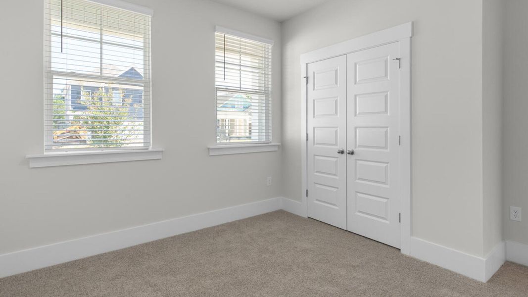 Spacious, unfurnished interior of a new home in Surfside Landing, Hubert (Image 20).