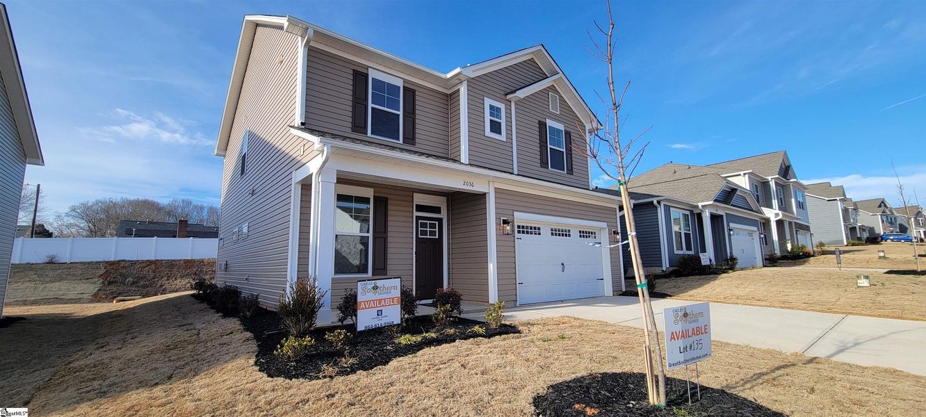 Front exterior of a new home in Halton Oaks, Spartanburg, SC, highlighting curb appeal (Image 19). Front exterior of a new home in Halton Oaks, Spartanburg, SC, highlighting curb appeal (Image 19).