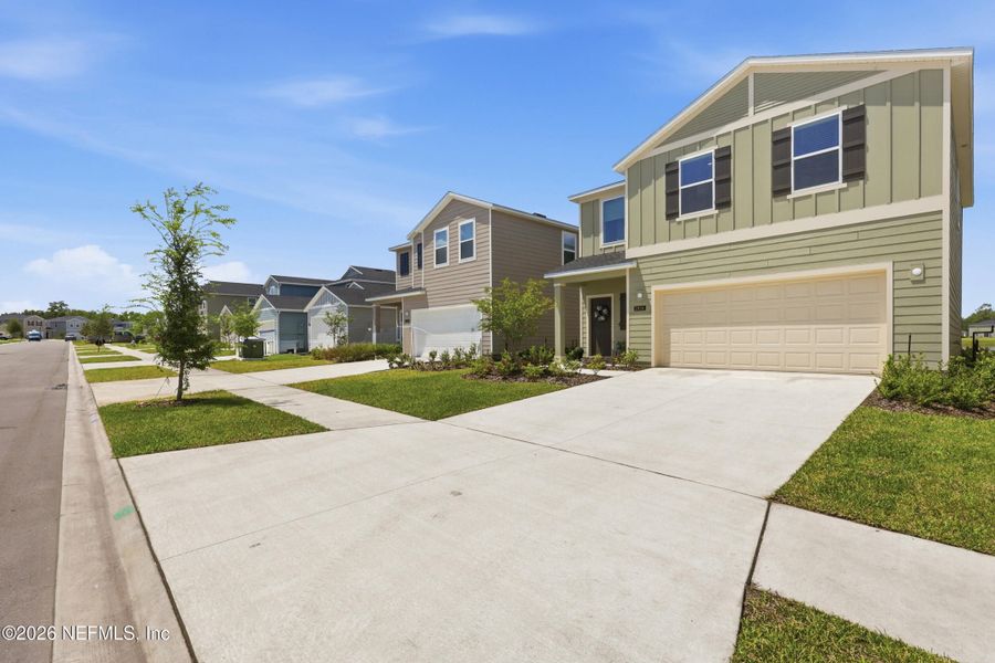 Front exterior of a new home in Holstein Crossing, Green Cove Springs, FL, highlighting curb appeal (Image 23).