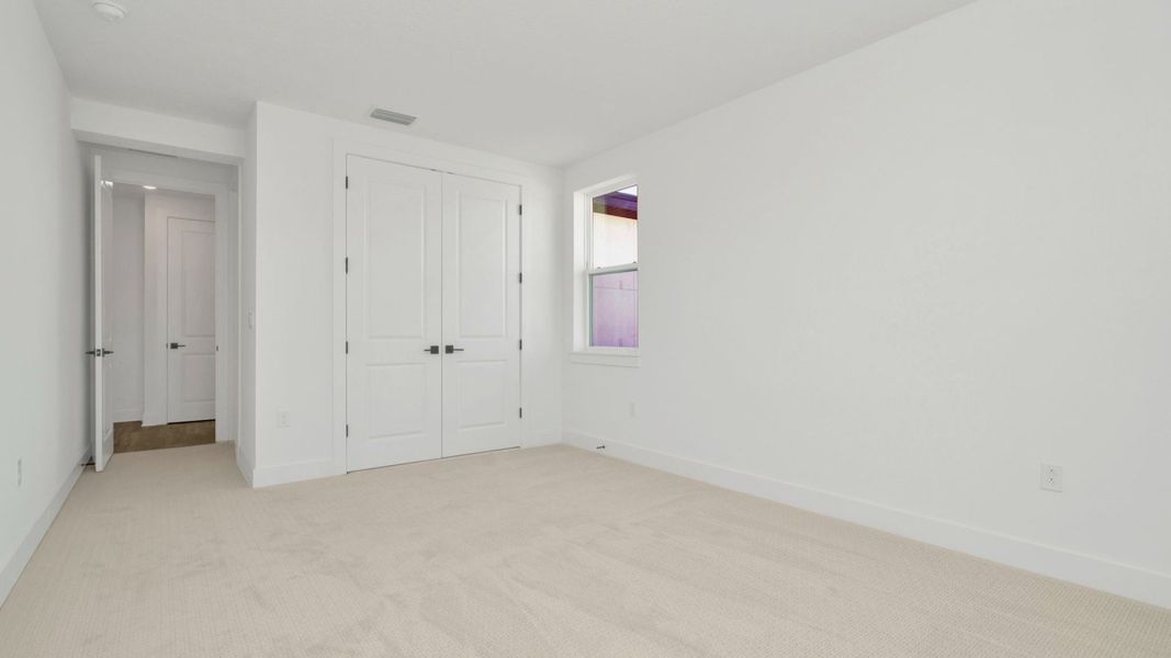 The Sixth Bedroom of a DRB Homes Grand Hawk which is offered as a home plan at Serengeti in Spring Hill, FL.