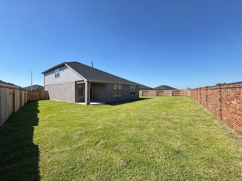 Exterior details and patio area of a home in Sunterra, Katy (Image 1).