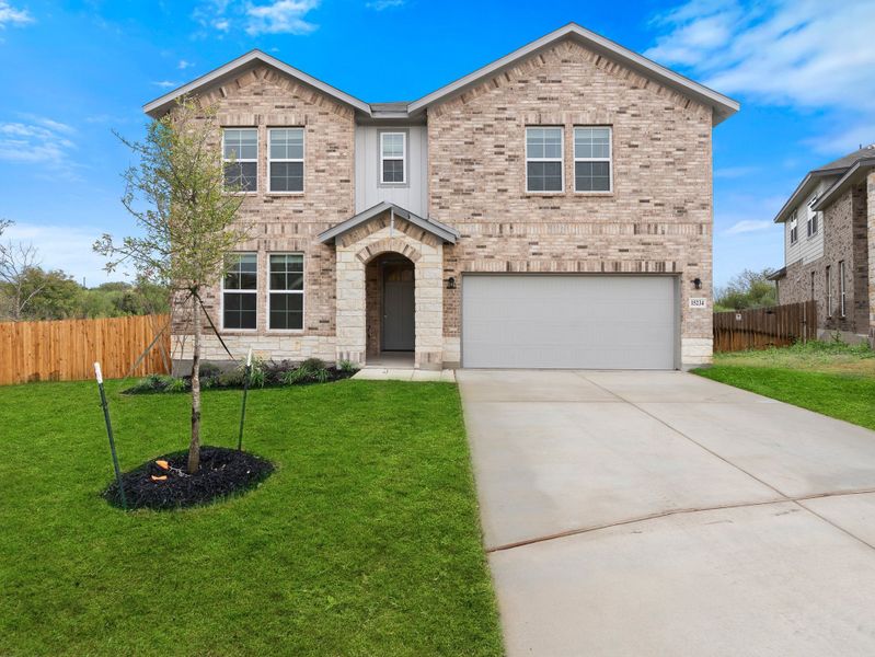 Front exterior of a new home in Comanche Ridge, San Antonio, TX, highlighting curb appeal (Image 1). Front exterior of a new home in Comanche Ridge, San Antonio, TX, highlighting curb appeal (Image 1).