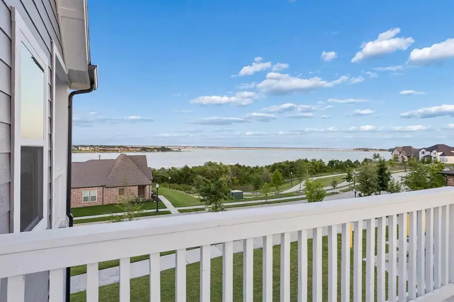 Morning Coffee with a View — The second-story balcony offers a front-row seat to Lake Ray Hubbard, creating the perfect setting to start the day or unwind beneath the evening sky.