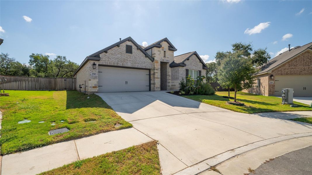 View of front of home featuring concrete driveway, brick siding, and an attached garage View of front of home featuring concrete driveway, brick siding, and an attached garage