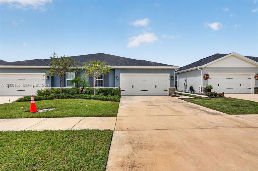 Front exterior of a new home in , Port St. Lucie, FL, highlighting curb appeal (Image 23). Front exterior of a new home in , Port St. Lucie, FL, highlighting curb appeal (Image 23).