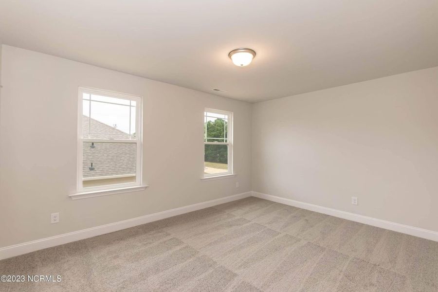 Representative unfurnished interior of a home built from the 3105 by Adams Homes in Parkland Place, Pace (Image 25).