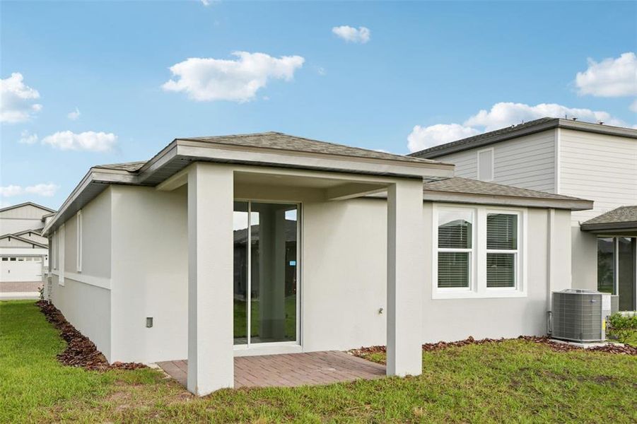Exterior details and patio area of a home in Springs at Lake Alfred - Classic Series, Lake Alfred (Image 24).