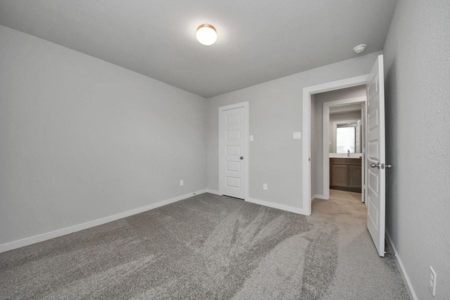 Generously sized secondary bedrooms featuring spacious closets, soft and inviting carpetingunderfoot, large windows allowing plenty of natural light, and the added touch of privacyblinds for your personal retreat. Sample photo of completed home with similar floor plan. Actual colors and selections may vary. Generously sized secondary bedrooms featuring spacious closets, soft and inviting carpetingunderfoot, large windows allowing plenty of natural light, and the added touch of privacyblinds for your personal retreat. Sample photo of completed home with similar floor plan. Actual colors and selections may vary.