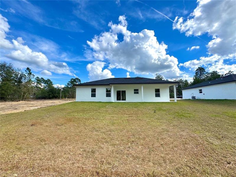 Exterior details and patio area of a home in , Citrus Springs (Image 20).