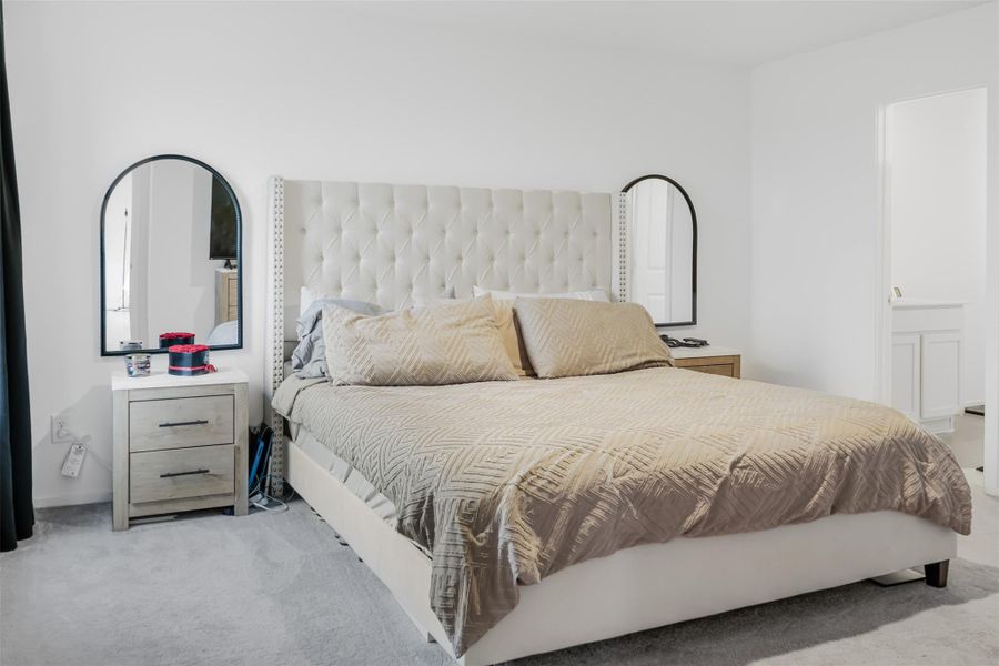 The Primary bedroom is bright and has access to an adjoining bathroom.