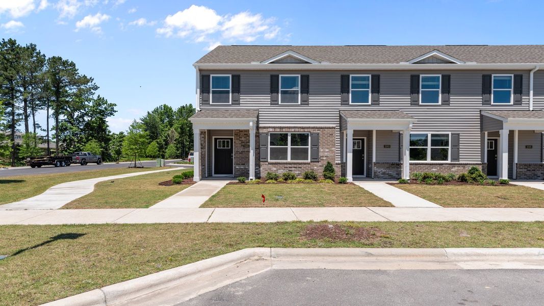 Representative exterior photo of a completed home built from the PEARSON II by D.R. Horton in Clock Road Townhomes, New Bern, NC (Image 1). Representative exterior photo of a completed home built from the PEARSON II by D.R. Horton in Clock Road Townhomes, New Bern, NC (Image 1).