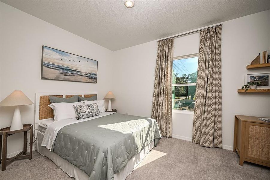 Furnished interior view inside a new home in Westview Community Group Page, Kissimmee (Image 9).