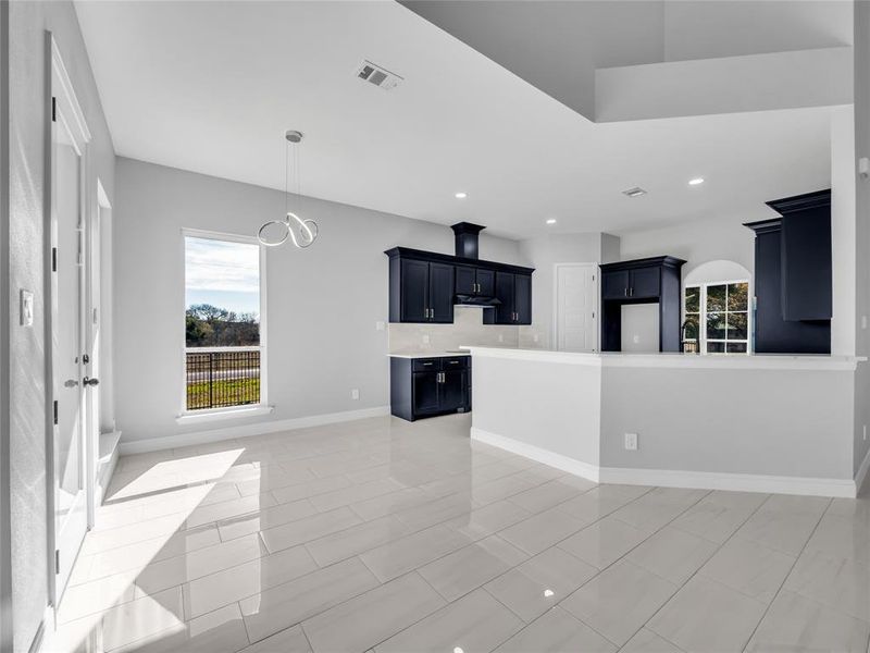Breakfast nook area off of kitchen with light fixture. Breakfast nook area off of kitchen with light fixture.