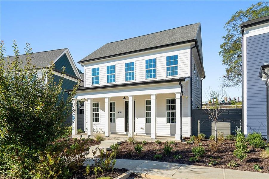 Front exterior of a new home in Harmony, Auburn, GA, highlighting curb appeal (Image 2). Front exterior of a new home in Harmony, Auburn, GA, highlighting curb appeal (Image 2).