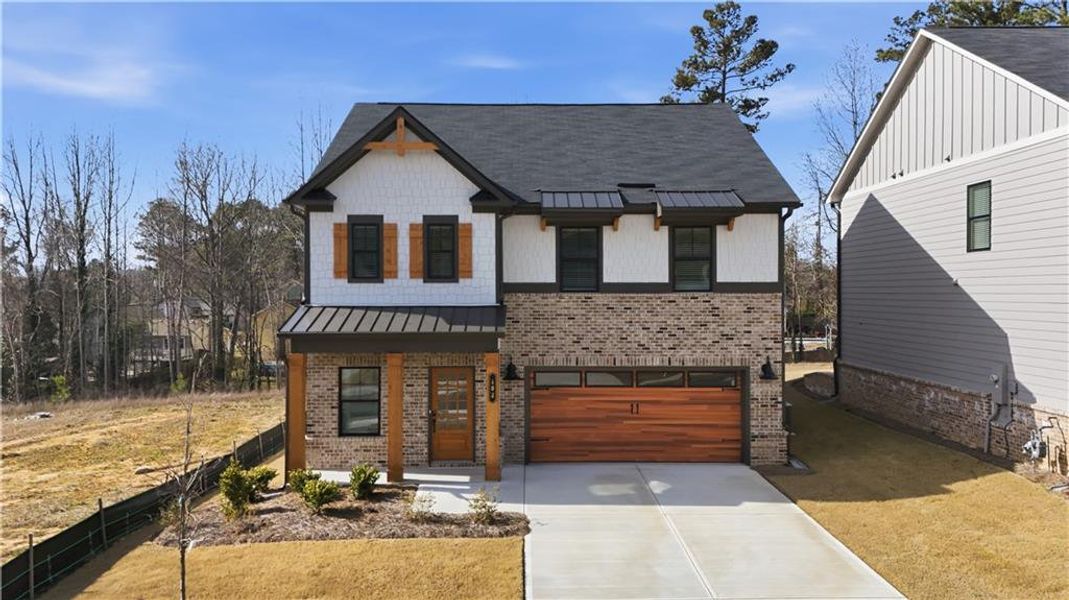 Front exterior of a new home in Meadow Pines, Dallas, GA, highlighting curb appeal (Image 2). Front exterior of a new home in Meadow Pines, Dallas, GA, highlighting curb appeal (Image 2).