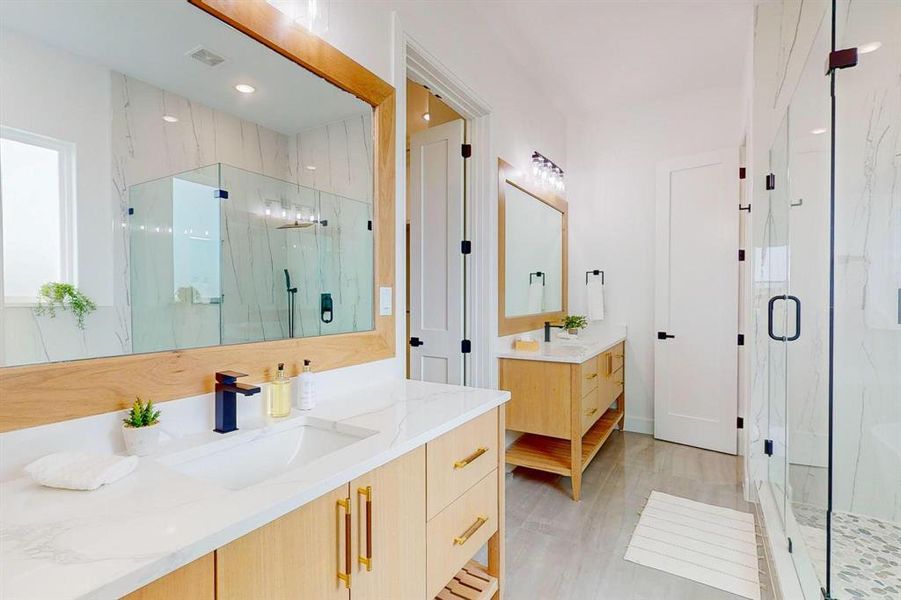 Bathroom featuring vanity and walk in shower