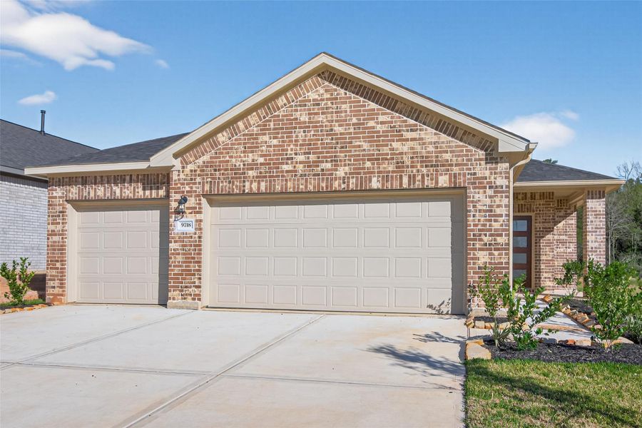 Front exterior of a new home in Enclave at Willis, Willis, TX, highlighting curb appeal (Image 19).