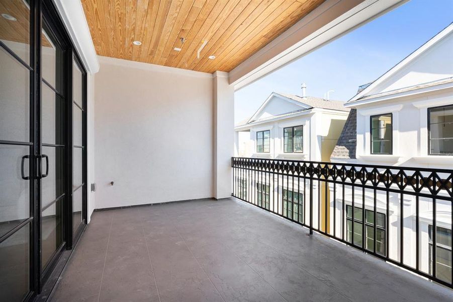 Ready for entertaining, this covered terrace is complete with pre-wiring for television system and speakers. (photo of interior model home with smaller floor plan)