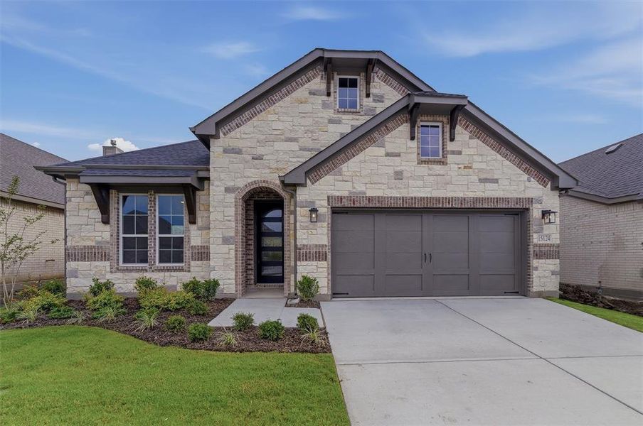 Stone and brick exterior with dark trim accents
