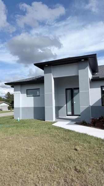 Exterior details and patio area of a home in , Lehigh Acres (Image 28). Exterior details and patio area of a home in , Lehigh Acres (Image 28).