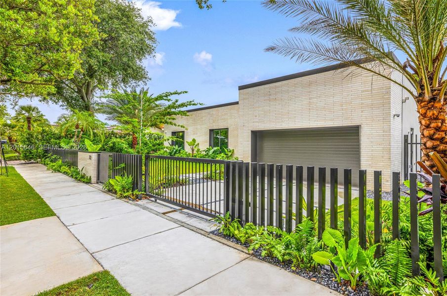 Front exterior of a new home in , Miami, FL, highlighting curb appeal (Image 1). Front exterior of a new home in , Miami, FL, highlighting curb appeal (Image 1).