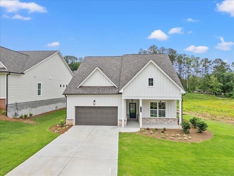 Front exterior of a new home in Cooks Farm, Woodstock, GA, highlighting curb appeal (Image 2).