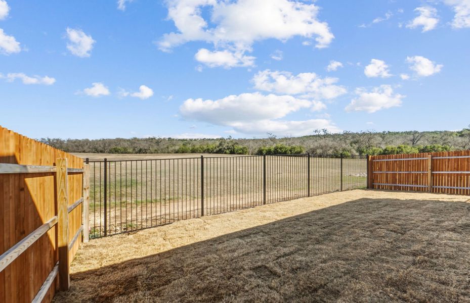 Exterior details and patio area of a home in Saddleback at Santa Rita Ranch, Liberty Hill (Image 27).