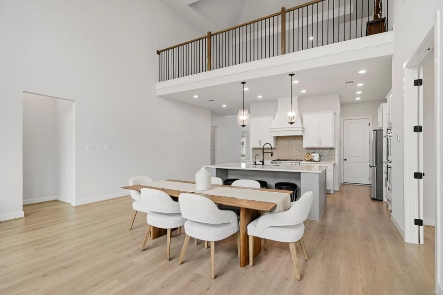 Well-placed recessed lighting casts a warm glow throughout the space, creating an elegant setting for everything from relaxed dinners to festive gatherings and special occasions.