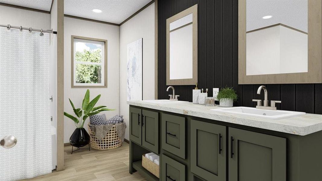 Bathroom featuring hardwood / wood-style flooring, dual vanity, crown molding, and a textured ceiling