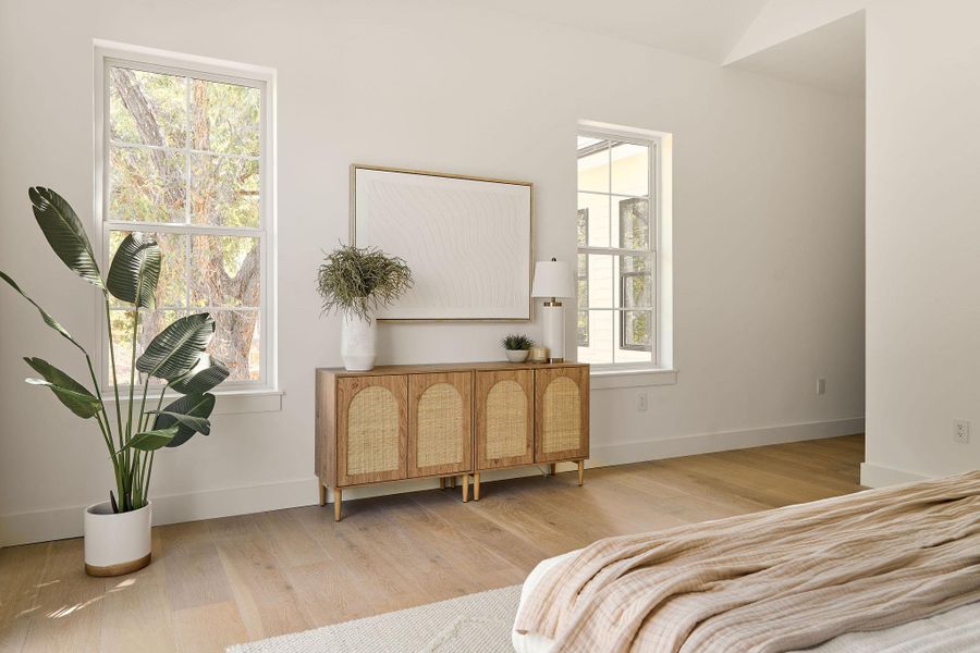 Bedroom featuring wood finished floors Bedroom featuring wood finished floors