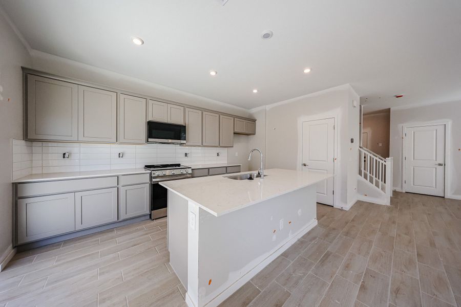 A kitchen with white cabinets. A kitchen with white cabinets.