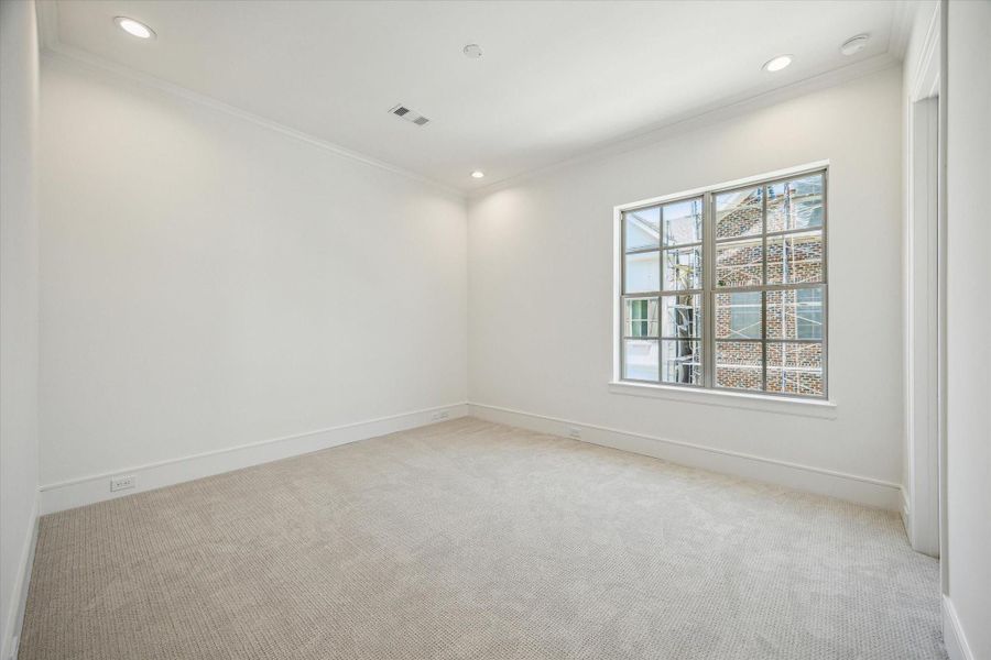 Second-floor Secondary Bedroom with walk-in closet, a perfect space for an office or guest room.