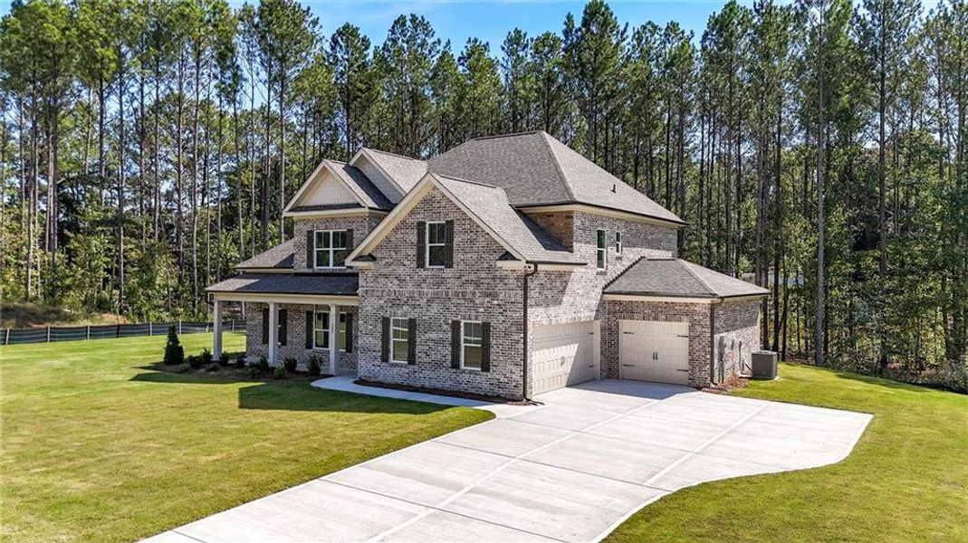 Front exterior of a new home in Palm Springs Manor Create Homes, Ellenwood, GA, highlighting curb appeal (Image 22). Front exterior of a new home in Palm Springs Manor Create Homes, Ellenwood, GA, highlighting curb appeal (Image 22).