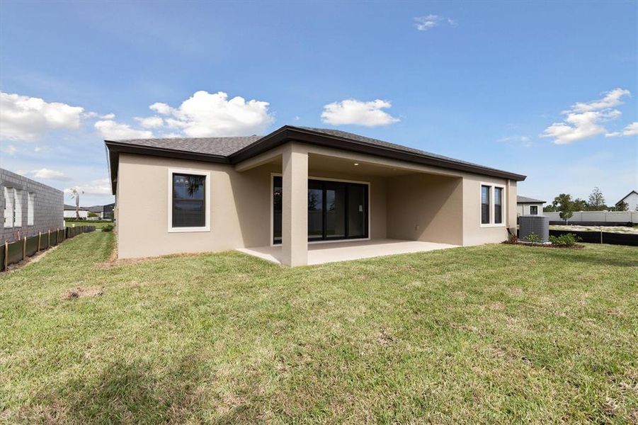 Exterior details and patio area of a home in Caldera, Spring Hill (Image 3).