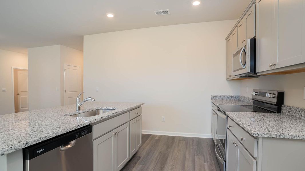 Representative furnished interior of a home built from the KERRY by D.R. Horton in Sandridge Park, Little River (Image 7).
