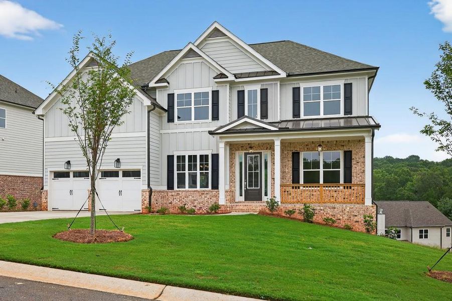 Front exterior of a new home in Traditions Of Braselton, Jefferson, GA, highlighting curb appeal (Image 26). Front exterior of a new home in Traditions Of Braselton, Jefferson, GA, highlighting curb appeal (Image 26).