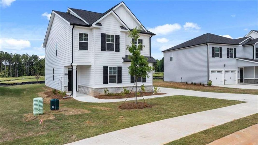 Front exterior of a new home in Oakchase at Hampton, Hampton, GA, highlighting curb appeal (Image 2).