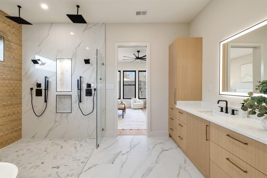 Bathroom featuring vanity and walk in shower