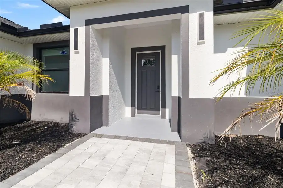 Exterior details and patio area of a home in , North Port (Image 19).