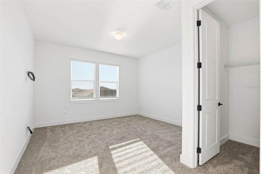 Spacious, unfurnished interior of a new home in Vida's Way, Wesley Chapel (Image 57).