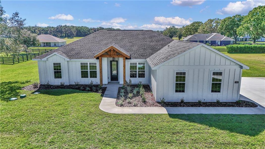 Front exterior of a new home in , Ocala, FL, highlighting curb appeal (Image 1).