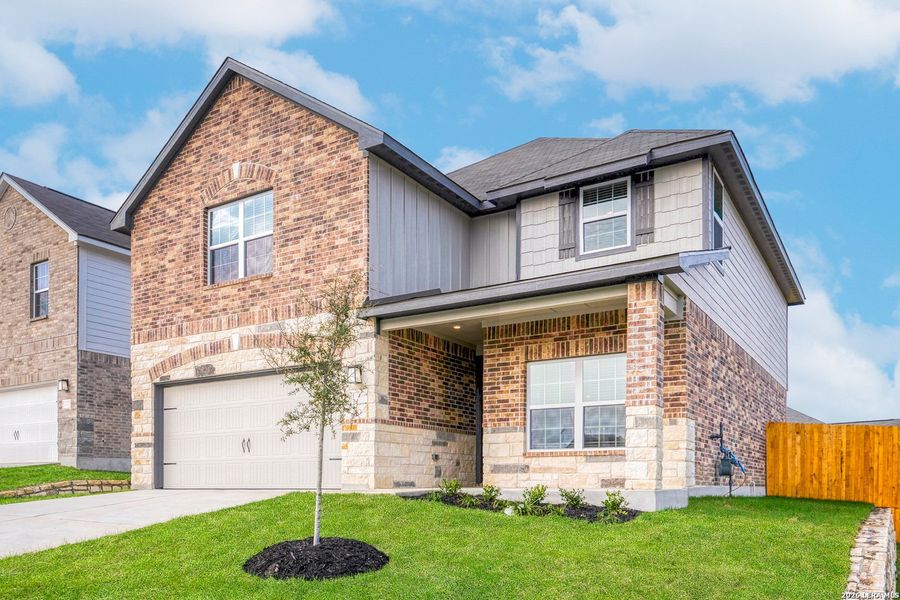 Front exterior of a new home in Hightop Ridge, Converse, TX, highlighting curb appeal (Image 2). Front exterior of a new home in Hightop Ridge, Converse, TX, highlighting curb appeal (Image 2).