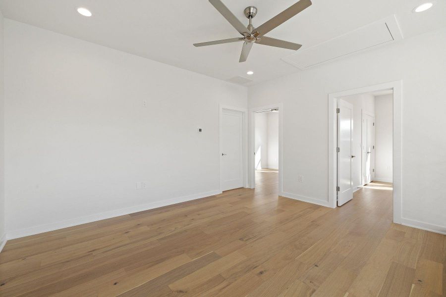 Spare room with attic access, recessed lighting, and light wood floors