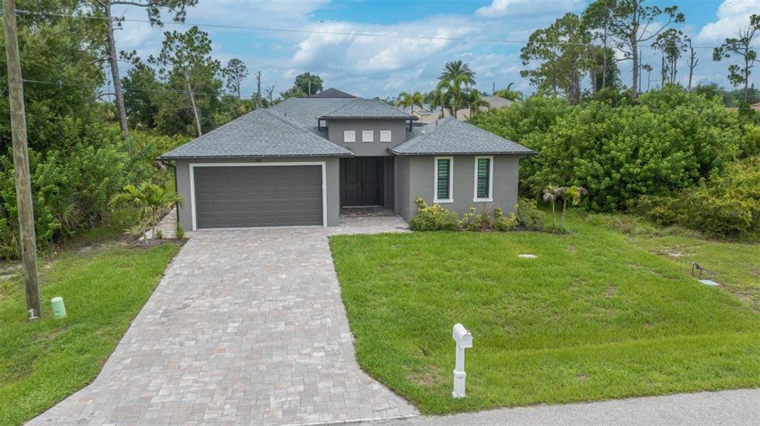 Front exterior of a new home in , Rotonda West, FL, highlighting curb appeal (Image 2). Front exterior of a new home in , Rotonda West, FL, highlighting curb appeal (Image 2).