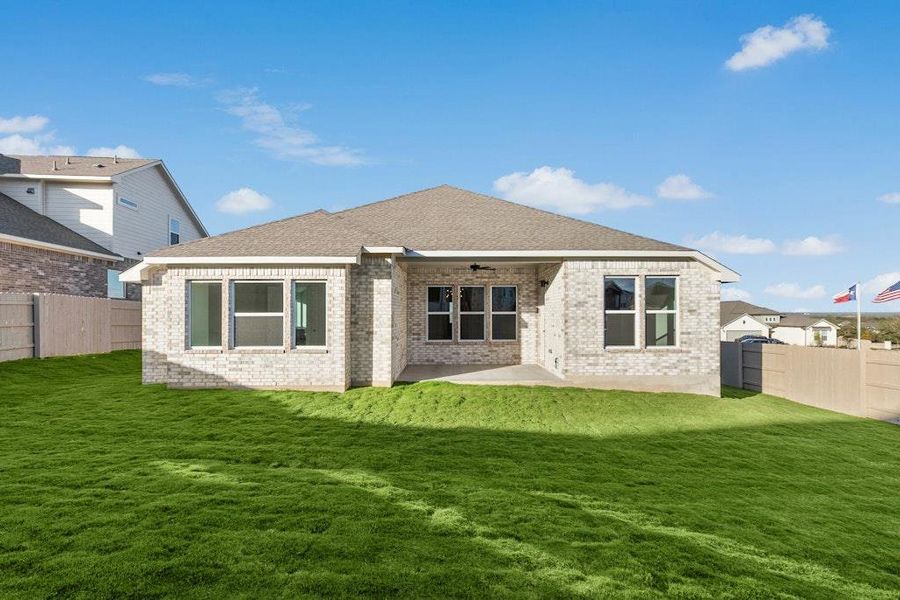 Rear view of property with a fenced backyard, a patio area, brick siding, a ceiling fan, and roof with shingles Rear view of property with a fenced backyard, a patio area, brick siding, a ceiling fan, and roof with shingles