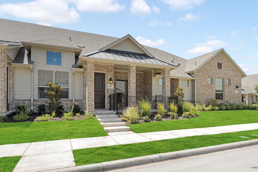 Front exterior of a new home in Woodbridge Villas, Wylie, TX, highlighting curb appeal (Image 26).