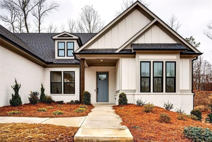 Front exterior of a new home in , Cumming, GA, highlighting curb appeal (Image 27).