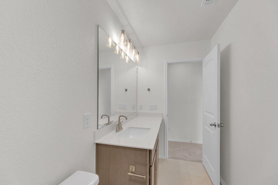 Furnished interior view inside a new home in Mustang Valley, Manor (Image 15).